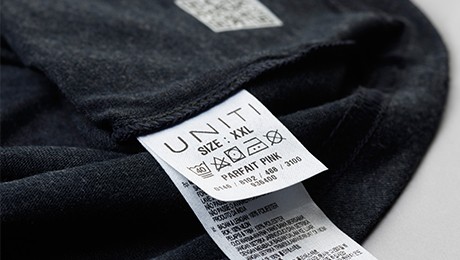 Close-up of a printed fabric label washing instruction